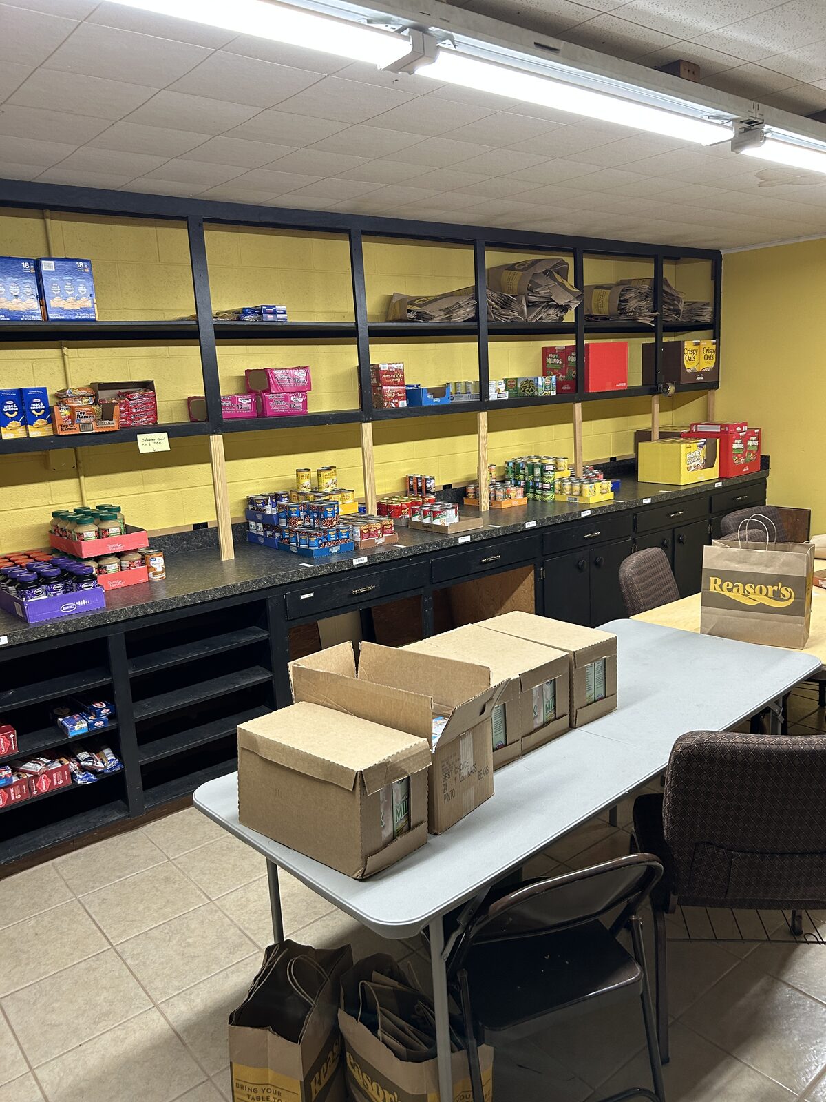 Restocked shelves at the Blue Starr food pantry, full of cereal, canned goods, and boxed food