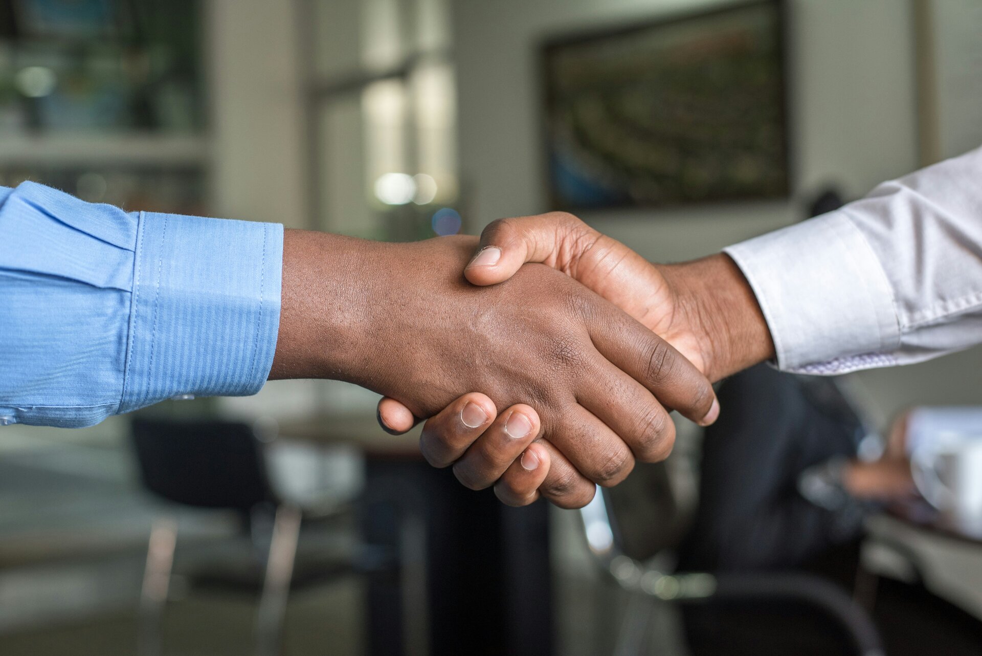 Two people shaking hands after a successful partnership