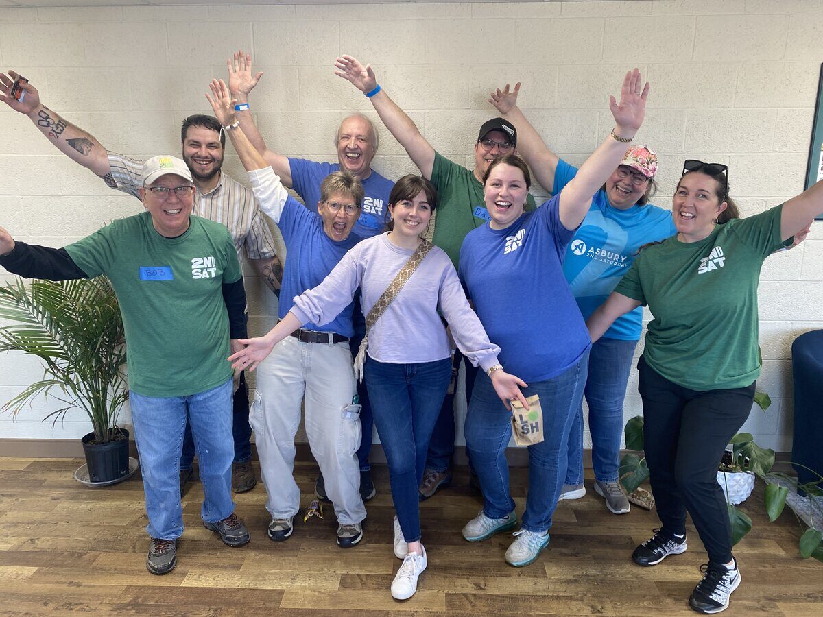 A partner volunteer team in matching shirts at a BeHeard Movement serve day