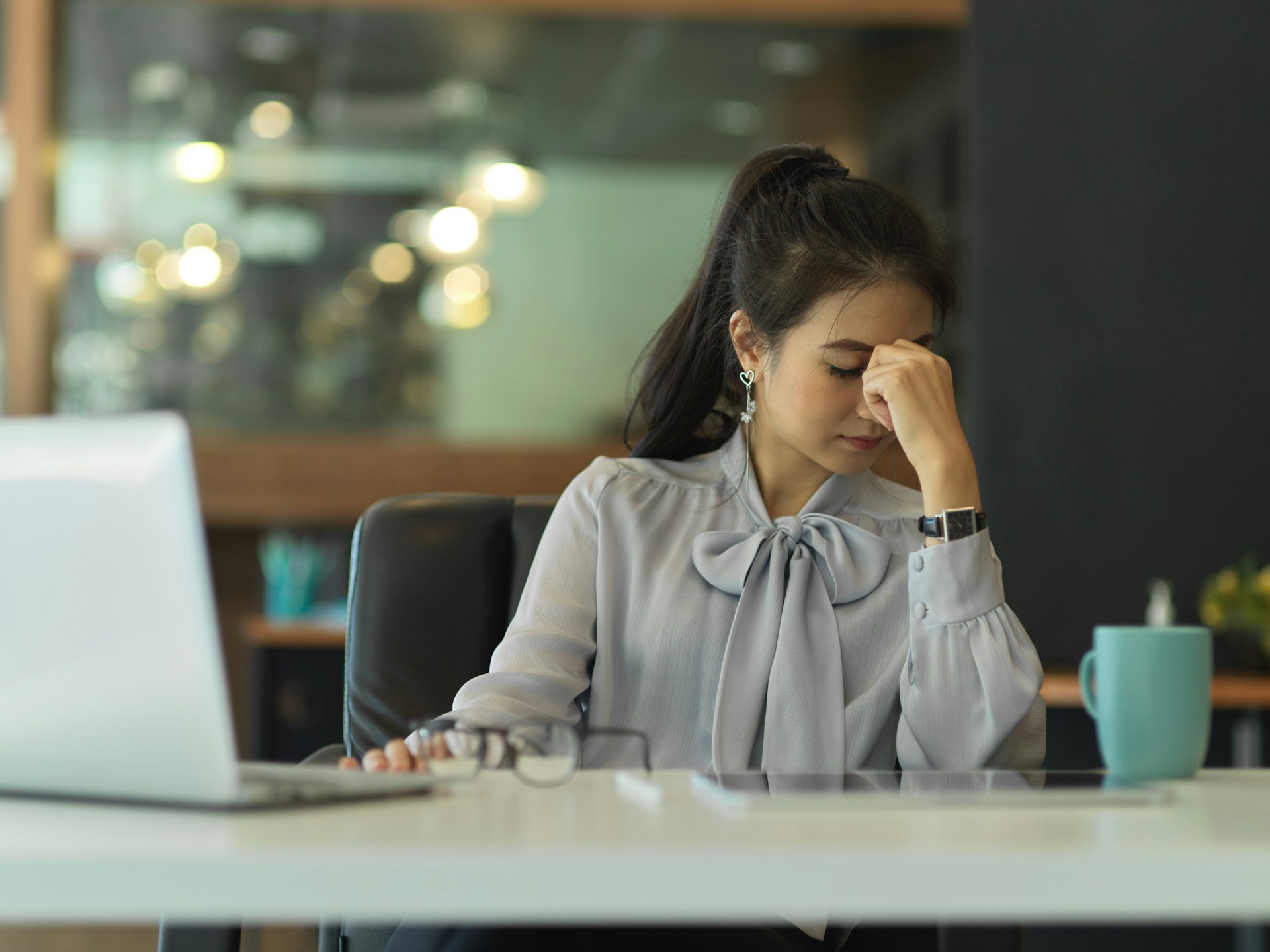 Nonprofit professional reviewing reports at her desk