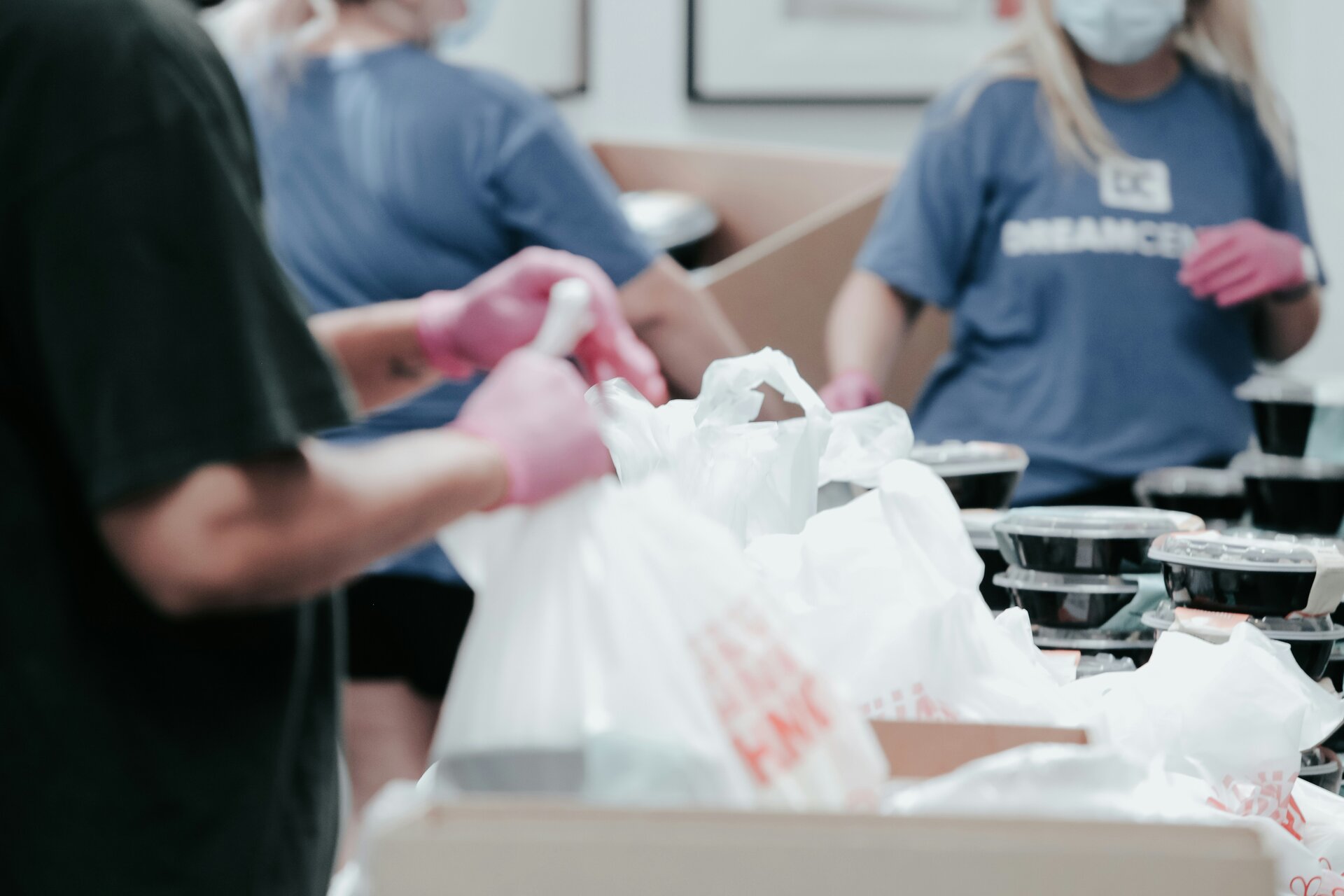 Food bank volunteers packing donations for community members